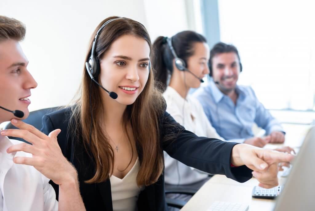 Businesswoman telemarketing staff working with new coworker team in call center officeBusinesswoman telemarketing staff working with new coworker team in call center office