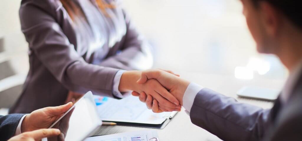 Business people shaking hands, finishing up a meeting